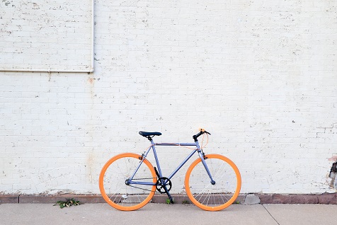 Blue bicycle with orange tires